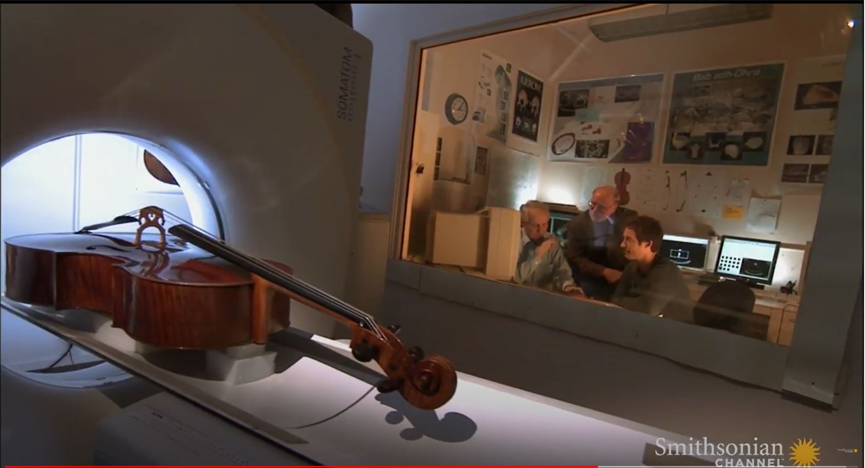 A YouTube video from the Smithsonian Channel that shows researchers using a CT Scanner to scan and measure the internal dimensions of string instruments. Host Tom Cavanagh observes the process of a delicate string instrument being placed in a CT Scanner. The researchers remark on how the data they collect is then provided to modern instrument manufacturers.