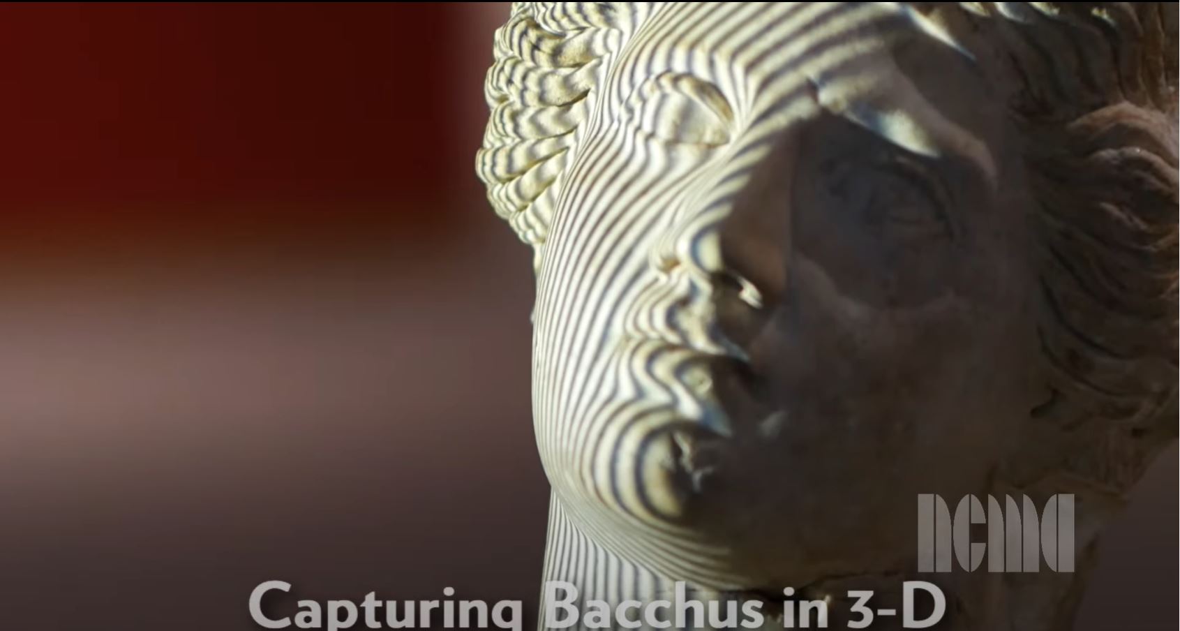 A YouTube video from the North Carolina Museum of Art details a statue of Bacchus that was scanned using a structured light scanner as part of a reconstruction project. Researchers use a human model to mold a replacement arm for the broken statue. They print a test model using a 3D printer before sculpting a final version to be fitted to the statue. Other broken elements of the statue are reattached and the artificial elements are painted to match the rest of the statue, completing the reconstruction.